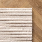 Pia 1612 creme · Moderner Teppich mit geschwungenem Linienmuster