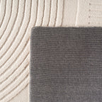 Pia 1612 creme · Moderner Teppich mit geschwungenem Linienmuster