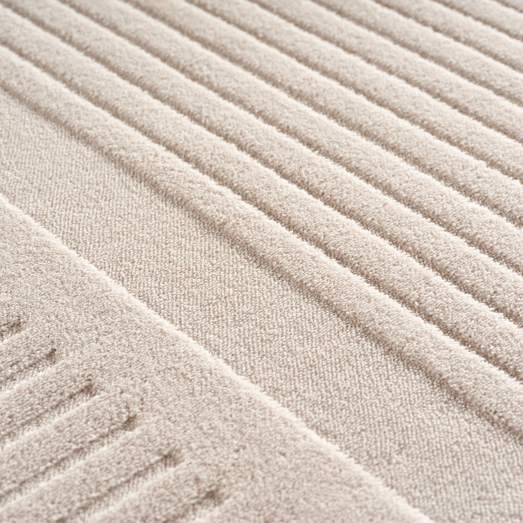 Pia 1612 creme · Moderner Teppich mit geschwungenem Linienmuster