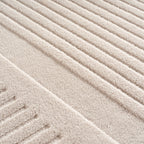 Pia 1612 creme · Moderner Teppich mit geschwungenem Linienmuster